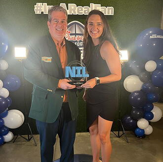 College Hunks team members accept award at NIL Summit